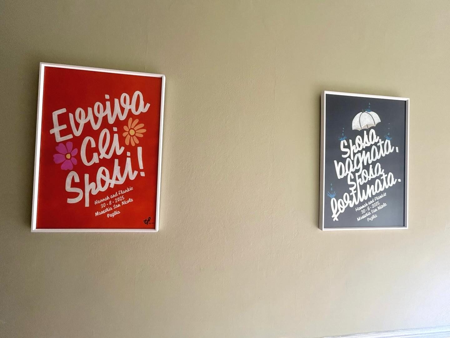Two framed hand-lettered wedding prints hanging on a wall Two framed hand-lettered wedding prints hanging on a wall